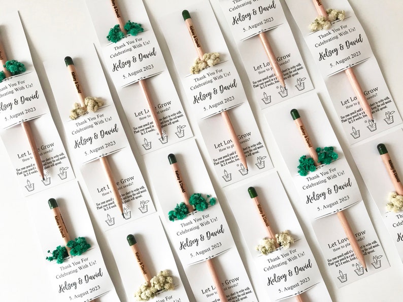 There are colorful flowers and a pencil with seeds on the card.