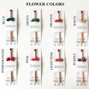 There are colorful flowers and a pencil with seeds on the card.