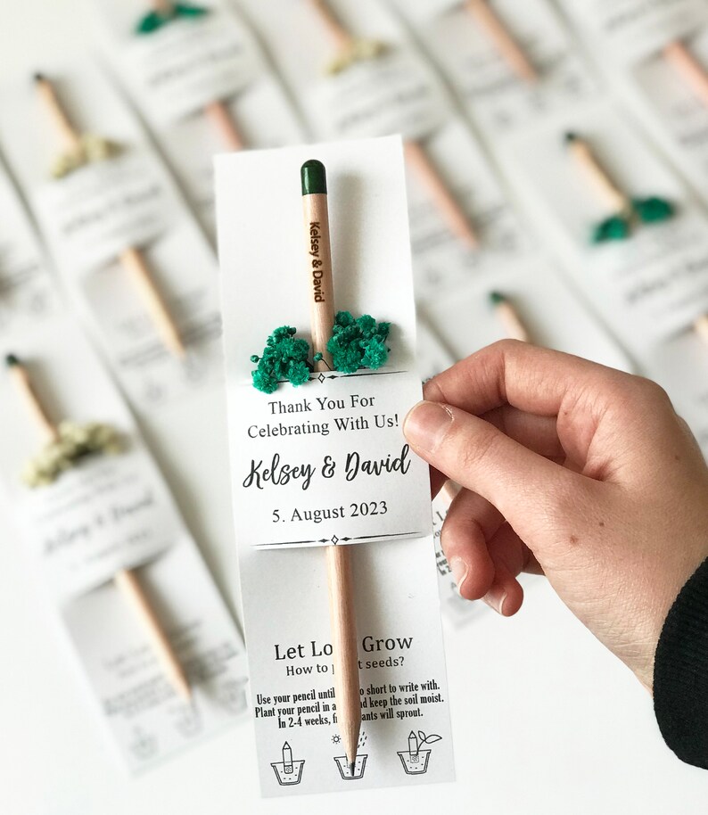 There are colorful flowers and a pencil with seeds on the card.