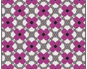 May include: A square quilt with a repeating floral pattern. The design features magenta flower shapes with black centers, set against a white and gray background. The quilt is framed by a black border.