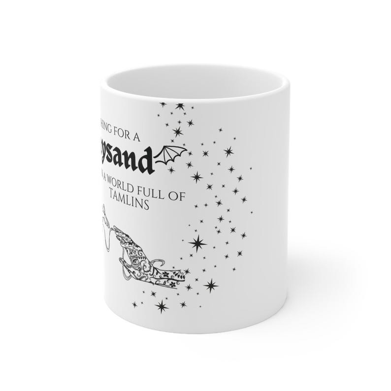 May include: White ceramic mug with a black design featuring a hand reaching for a star with the text "Wishing for a Feywild" and "A world full of Tamlins".