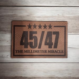 May include: A brown leather doormat with the text "45/47 THE MILLIMETER MIRACLE" and five stars.