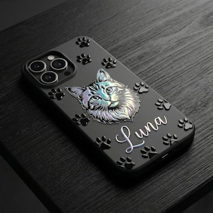 May include: A matte black smartphone case featuring a holographic illustration of a cat face centered on the back. The case is decorated with multiple raised black paw prints and the name Luna written in a white cursive script font.