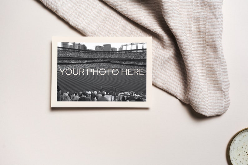 May include: A black and white photograph of a baseball stadium with the text "YOUR PHOTO HERE" printed on the image. The photograph is in a cream-colored frame, with a beige and white striped fabric in the background.