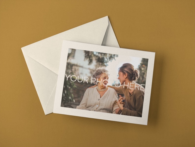 May include: A cream-colored greeting card and envelope set. The card features a photograph of two people with the text "YOUR PHOTO HERE". The background is a solid mustard color.