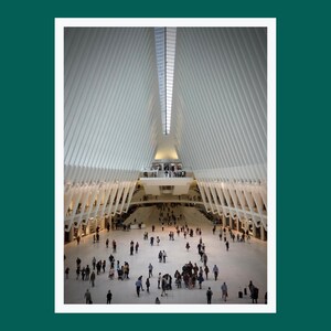 May include: A large, open space with a white, geometric ceiling and many people walking around. The ceiling is made up of many white panels that are arranged in a grid pattern. The space is brightly lit and there are many windows on the sides of the space.