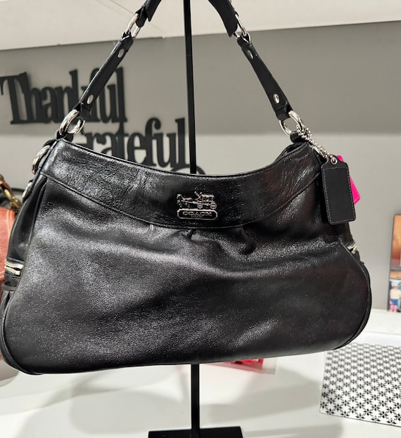 Black leather coach online purse with purple lining