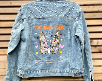 Custom Taylor Eras Tour Butterfly denim jacket with pearls and surprise tour badge :)