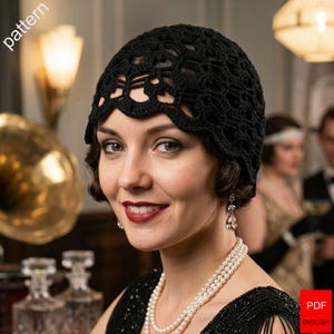 May include: A black crochet cloche hat featuring an intricate openwork pattern with a scalloped edge. The hat is fitted to the head and displays a detailed, repeating geometric design throughout the fabric, crafted from dark black yarn.