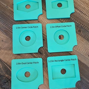 May include: Six turquoise blue quilting templates with different shapes and sizes. The templates are labeled with their shape and size in inches. The shapes include a hexagon, circle, oval, and rectangle.