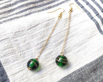 Earrings with green bead on chain