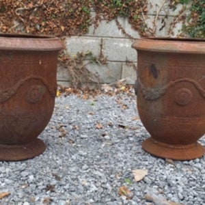 Set of 16 cast iron urns