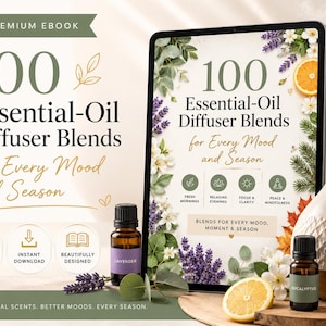 May include: A digital tablet displaying an ebook titled 100 Essential-Oil Diffuser Blends for Every Mood and Season, surrounded by two amber glass essential oil bottles labelled Lavender and Eucalyptus, and a ceramic ultrasonic oil diffuser.