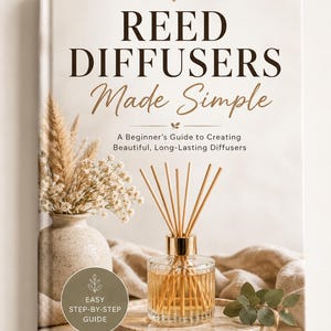 May include: A hardcover book titled REED DIFFUSERS Made Simple, A Beginner's Guide to Creating Beautiful, Long-Lasting Diffusers. The cover features a glass reed diffuser on a speckled plate, a vase with dried flowers, and a circular badge with text.