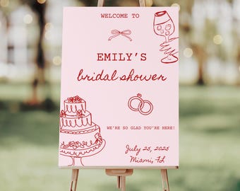 Könnte beinhalten: Ein rosa Schild auf einer Staffelei mit den Worten "WELCOME TO EMILY'S bridal shower" in roter Schrift. Das Schild enthält Illustrationen einer Schleife, eines Weinglases, einer Torte und Ringen. Das Datum 25. Juli 2025 und Miami, FL werden ebenfalls angezeigt.
