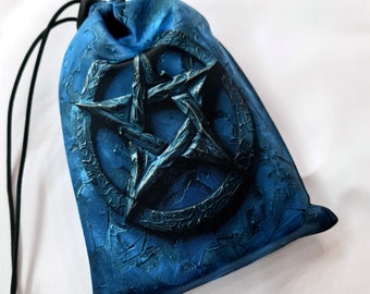 May include: Blue velvet dice bag with a pentagram design. The bag has a drawstring closure.