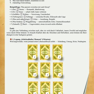 May include: A page from a book featuring a German text guide for a nine-card tarot spread titled Schicksalhafter Moment. The page includes a numbered list of steps, an example reading, and a grid of nine identical gold-toned cards with green patterns.