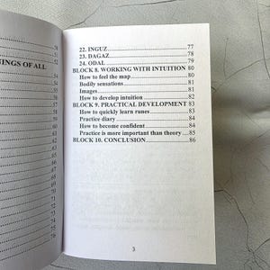 May include: Open book with a detailed table of contents. The page numbers are visible, along with chapter titles such as "Working with Intuition" and "Practical Development." The number "3" is printed at the bottom of the page.