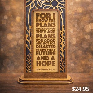 May include: Wooden plaque with the Bible verse Jeremiah 29:11. The plaque has a dark brown frame with a light brown interior. The text "FOR I KNOW THE PLANS" is visible. The plaque is a rustic Christian gift.