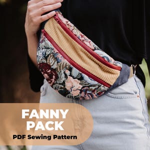 Könnte beinhalten: Eine Fanny Pack aus floralem Wandteppich mit einem Cord-Mittelteil und roten Reißverschlüssen. Die Tasche hat eine Jeans-Basis und einen beigefarbenen Riemen. Der Text "FANNY PACK PDF Sewing Pattern" wird angezeigt.