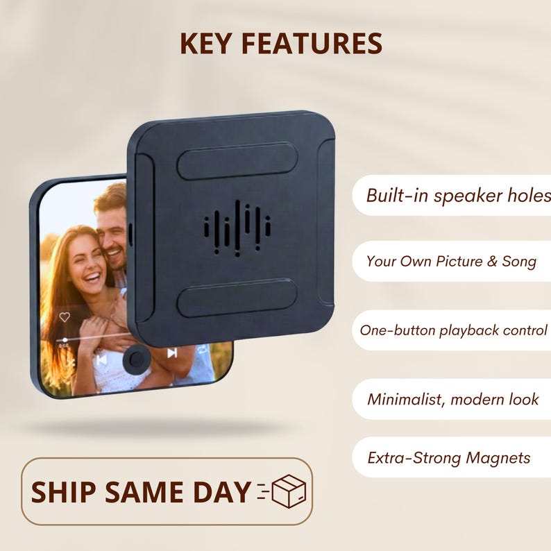 May include: A black square device with built-in speaker holes, displaying a photo of a smiling couple. The device features one-button playback control and extra-strong magnets. Text on the image reads "Key Features".