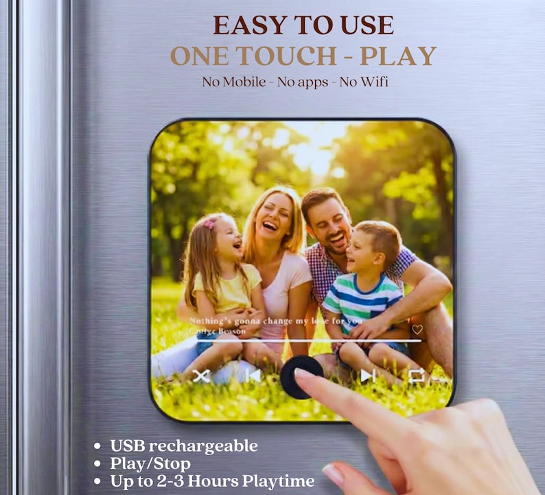 May include: A rectangular, black and silver device with rounded corners, featuring a family photo on the screen. The device has the text "EASY TO USE" and "ONE TOUCH - PLAY". Additional text includes "USB rechargeable", "Play/Stop", and "Up to 2-3 Hours Playtime".
