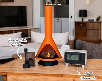May include: Orange and black modern fireplace with a glowing fire, a wooden tool holder with a shovel and tongs, and a white digital thermometer with a black frame that reads "40 80.4%".
