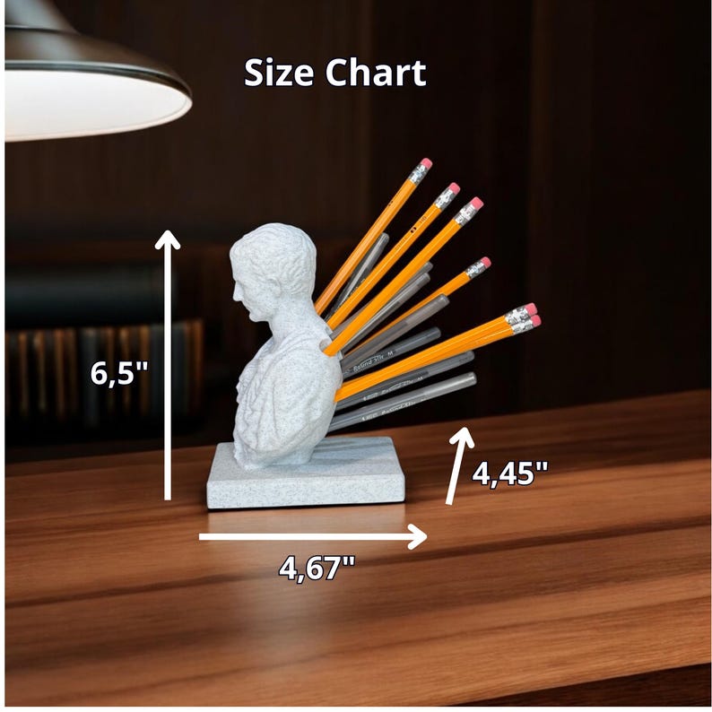 May include: A white plaster bust of a man with pencils sticking out of his back. The bust is on a gray base and measures 6.5 inches tall, 4.67 inches wide, and 4.45 inches deep. Size Chart.