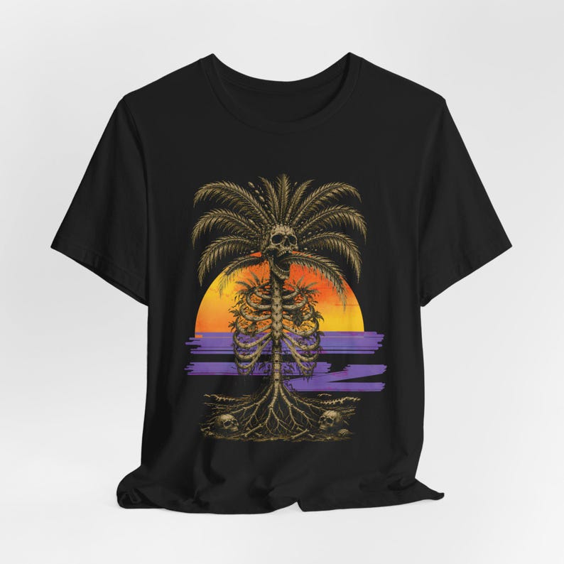 May include: A black short-sleeve t-shirt featuring a graphic print of a palm tree with a human ribcage as its trunk and a skull at the top. The design includes a sunset background with orange and yellow hues, purple horizontal lines, and roots.