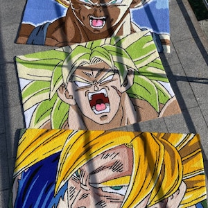 May include: Three rectangular rugs featuring characters from the Dragon Ball Z anime series. The top rug depicts Vegeta with brown hair and a blue background. The middle rug shows Broly with green hair. The bottom rug features Goku with yellow hair.