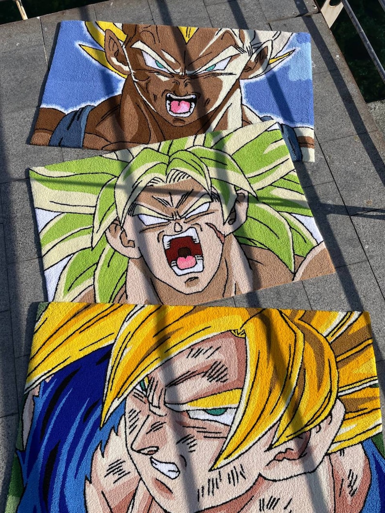 May include: Three rectangular rugs featuring characters from the Dragon Ball Z anime series. The top rug depicts Vegeta with brown hair and a blue background. The middle rug shows Broly with green hair. The bottom rug features Goku with yellow hair.