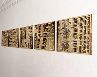 May include: Five gold metal wall decor panels with a geometric pattern. The panels are arranged in a row on a white wall.