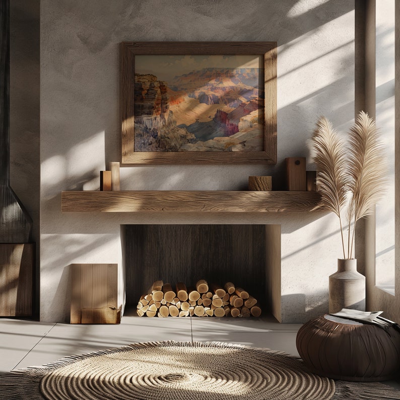May include: A rustic fireplace with a wooden mantel and a framed landscape painting above it. The fireplace is filled with stacked logs and there is a woven rug in front of it.
