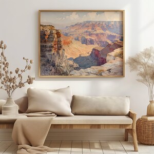 May include: A framed watercolor painting of the Grand Canyon, featuring a panoramic view of the layered rock formations in shades of red, orange, and brown.