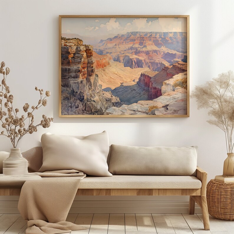 May include: A framed watercolor painting of the Grand Canyon, featuring a panoramic view of the layered rock formations in shades of red, orange, and brown.