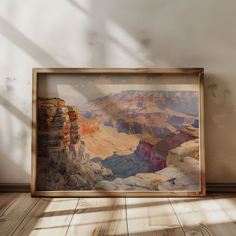 May include: A framed watercolor painting depicting a panoramic view of the Grand Canyon. The painting features a variety of colors, including shades of brown, red, orange, and blue. The canyon is shown in the distance, with a closer view of the canyon rim in the foreground.