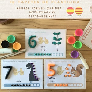 May include: Playdough mats for kids to learn numbers. The mats feature colorful illustrations of a ladybug, a dinosaur, and a squirrel. The mats are labeled with the numbers 5, 6, and 7 in Spanish and Catalan. The mats also include a counting section with circles for kids to place playdough.