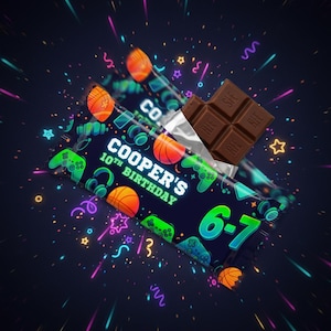 May include: A dark blue chocolate bar wrapper with basketballs, game controllers, and headphones. The text "COOPER'S 10TH BIRTHDAY" is displayed. The chocolate bar is partially unwrapped, revealing a dark chocolate bar.