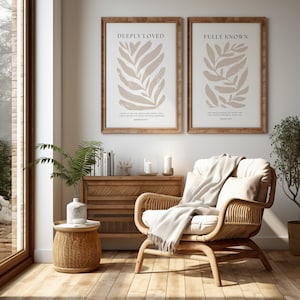 May include: Two framed prints with beige leaf illustrations and inspirational quotes. The quote on the left print is "Deeply Loved" with the scripture "I have loved you with an everlasting love; I have drawn you with unfailing kindness." Jeremiah 31:3. The quote on the right print is "Fully Known" with the scripture "You have searched me, Lord, and you know me." Psalm 139:1.