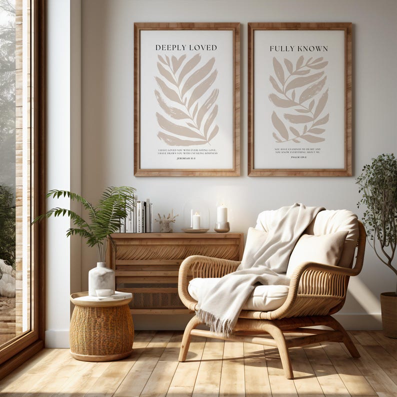 May include: Two framed prints with beige leaf illustrations and inspirational quotes. The quote on the left print is "Deeply Loved" with the scripture "I have loved you with an everlasting love; I have drawn you with unfailing kindness." Jeremiah 31:3. The quote on the right print is "Fully Known" with the scripture "You have searched me, Lord, and you know me." Psalm 139:1.