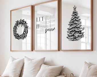May include: Three framed mirrors with wooden frames. The left mirror features a black and white wreath illustration. The center mirror has the text "LET IT snow". The right mirror displays a Christmas tree illustration.