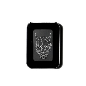 May include: Black metal lighter featuring a white outline of a Japanese demon mask.