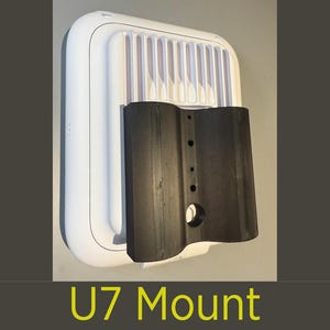 May include: A white rectangular device with a ridged top and a black curved mount attached. The text "U7 Mount" is displayed in yellow at the bottom of the image.