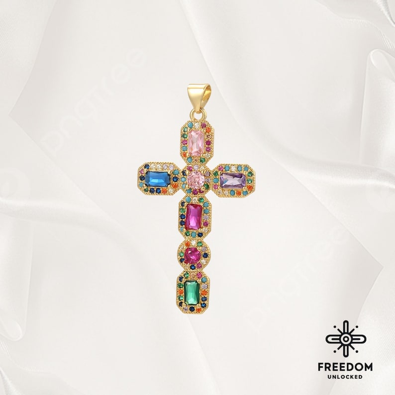 May include: A gold cross pendant with colorful rectangular gemstones. The cross is adorned with pink, blue, green, and purple stones.