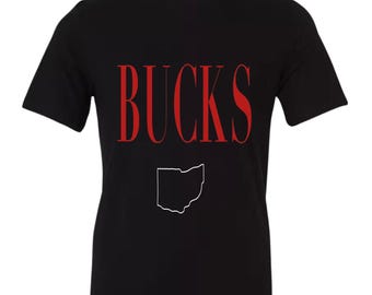 May include: Black t-shirt with the word "BUCKS" in red letters and an outline of the state of Ohio in white.