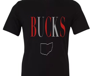 May include: Black t-shirt with the word "BUCKS" in red, white and grey letters. The outline of the state of Ohio is in white below the word.