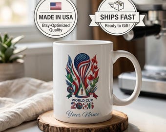 May include: A set of three ceramic mugs with a speckled, matte finish. The mugs are in shades of cream, light gray, and dark gray. Each mug has a simple, minimalist design and a rounded handle.
