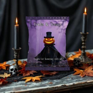 May include: A Halloween-themed image featuring a purple bag with "Tricks & Treats" text and a jack-o'-lantern figure. The scene includes lit candles, skulls, and autumn leaves, creating a spooky atmosphere. The text "Thanks for haunting with us!" is also visible.