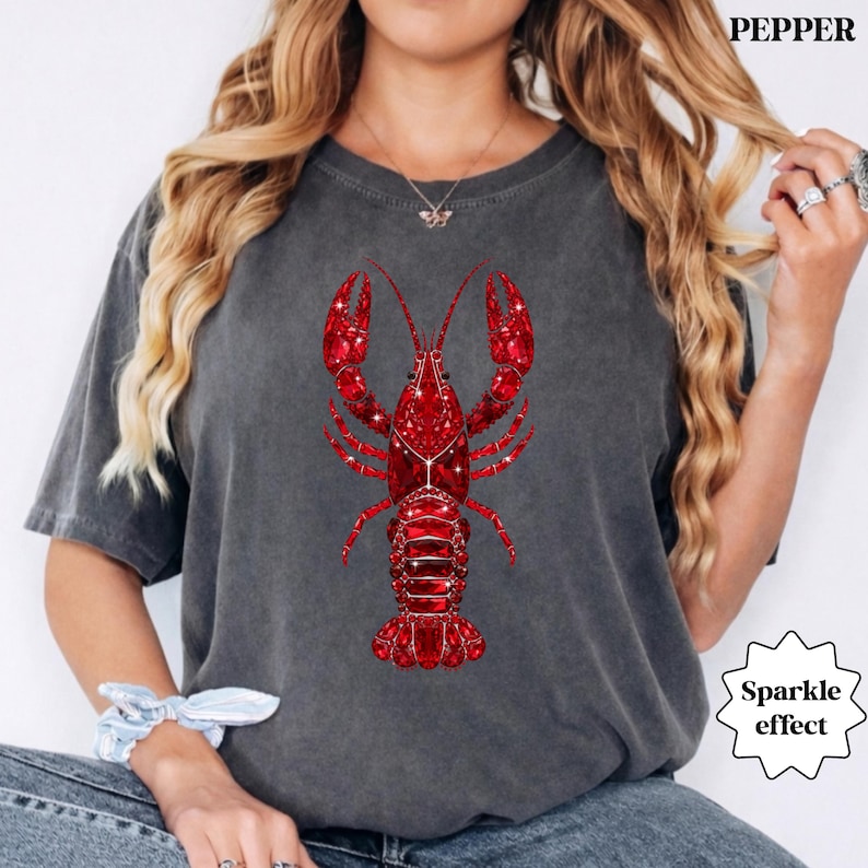 woman wearing comfort colors lobster shirt with red sparkle lobster graphic