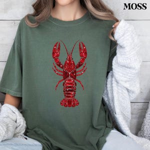 coastal summer outfit with lobster shirt and casual styling
relaxed fit lobster shirt styled for beach vacation look